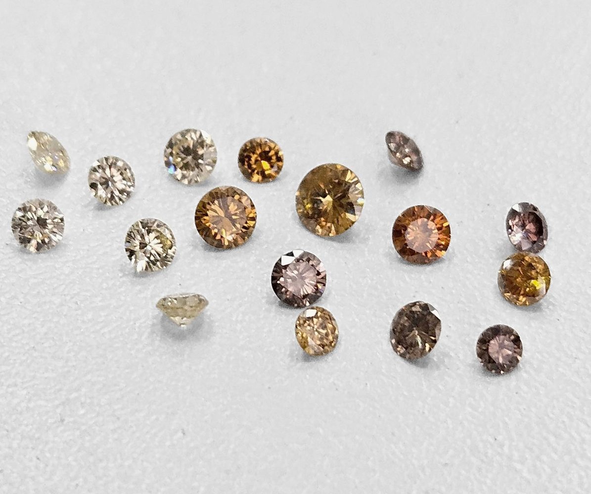 Loose warm diamonds showing a range of pale, golden and brown shades