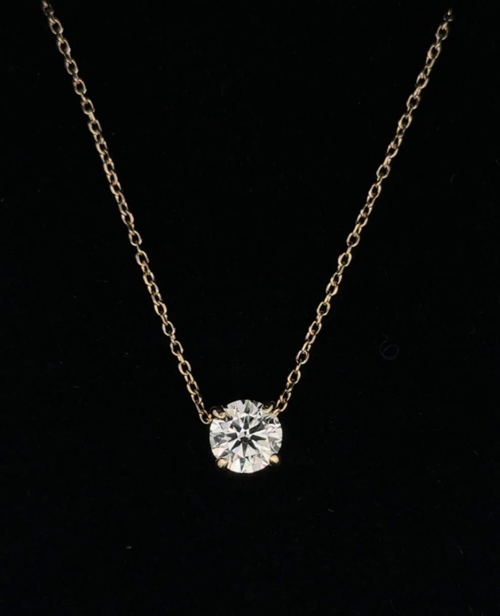Finished 14k yellow gold lab-grown diamond solitaire necklace.