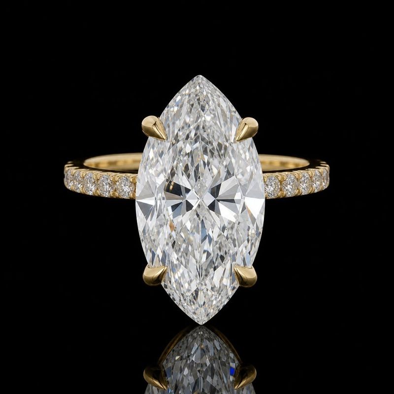 Marquise center on a slender accent-stone band