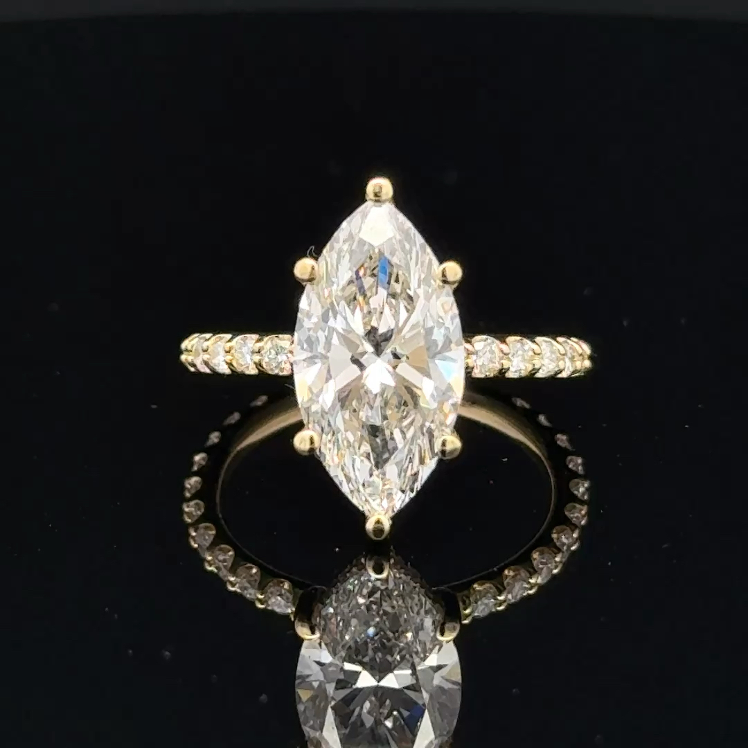 Front view of the finished 3ct marquise diamond engagement ring in 18k yellow gold.