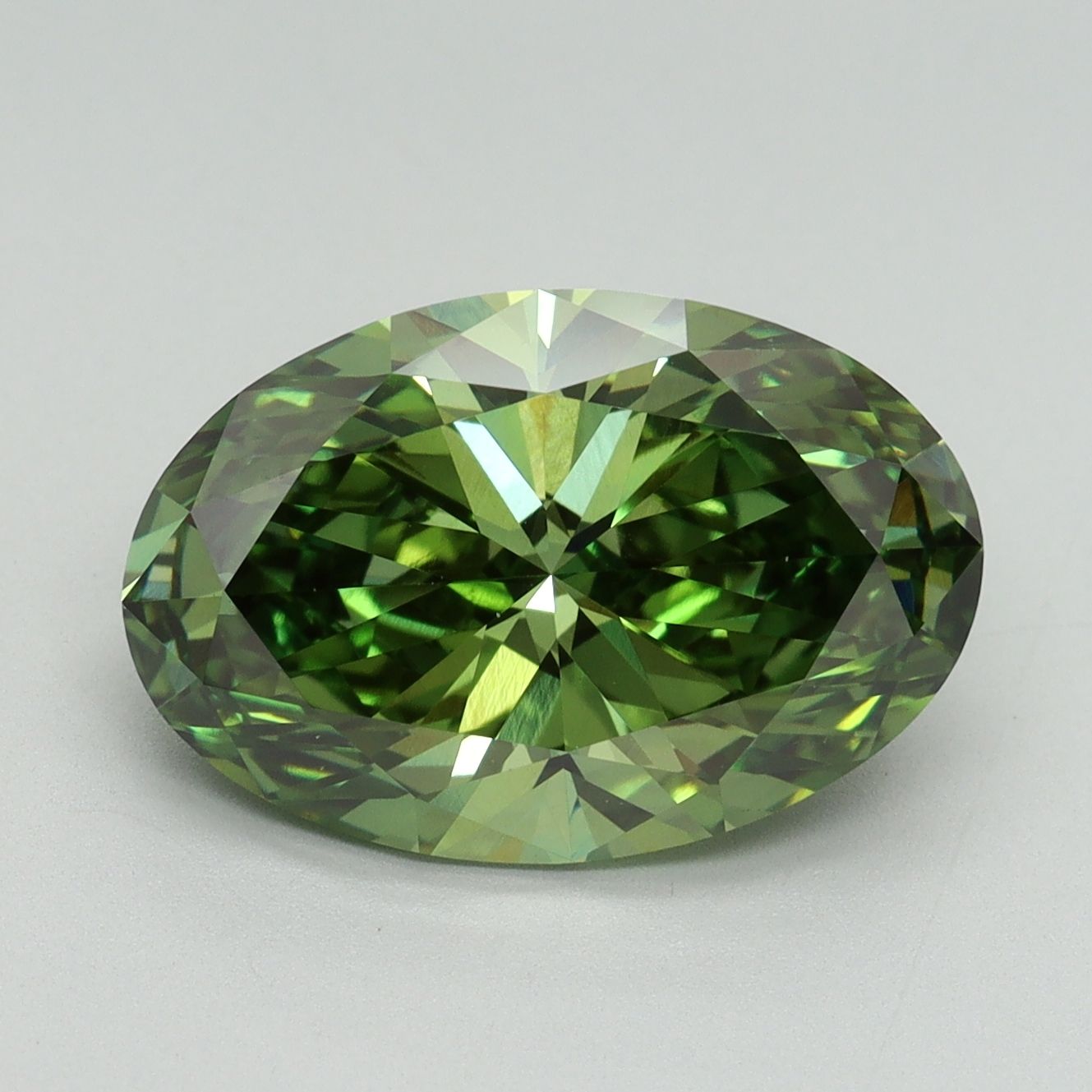 Green oval diamond photographed face-up