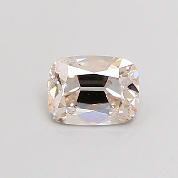 Pale warm-toned rectangular faceted stone on a neutral background